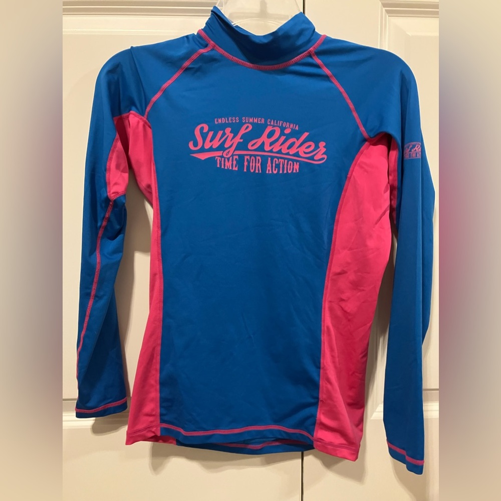 Tesla long sleeved rash guard. Great condition. Women’s small.